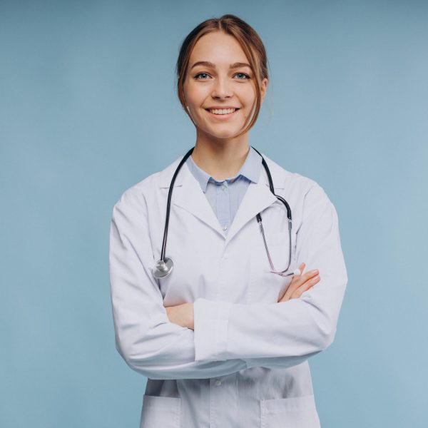 Woman doctor wearing lab coat with stethoscope isolated